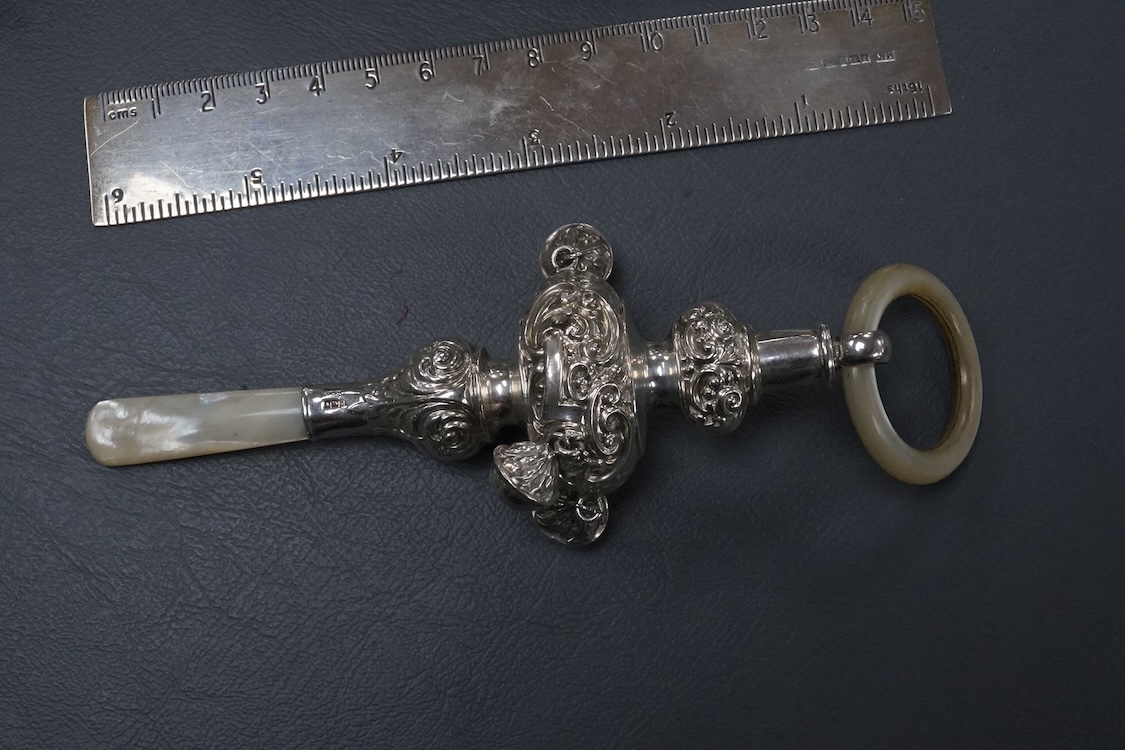 A small group of collectable silver including a Dutch miniature silver cradle box, import marks for London, 1898, 53mm, two other white metal miniature items including a chair, a continental 930 white metal taste vin, a